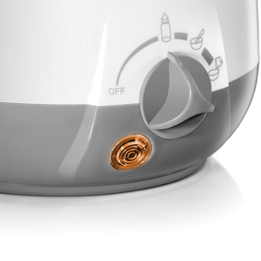 Bottle warmer for massage oil